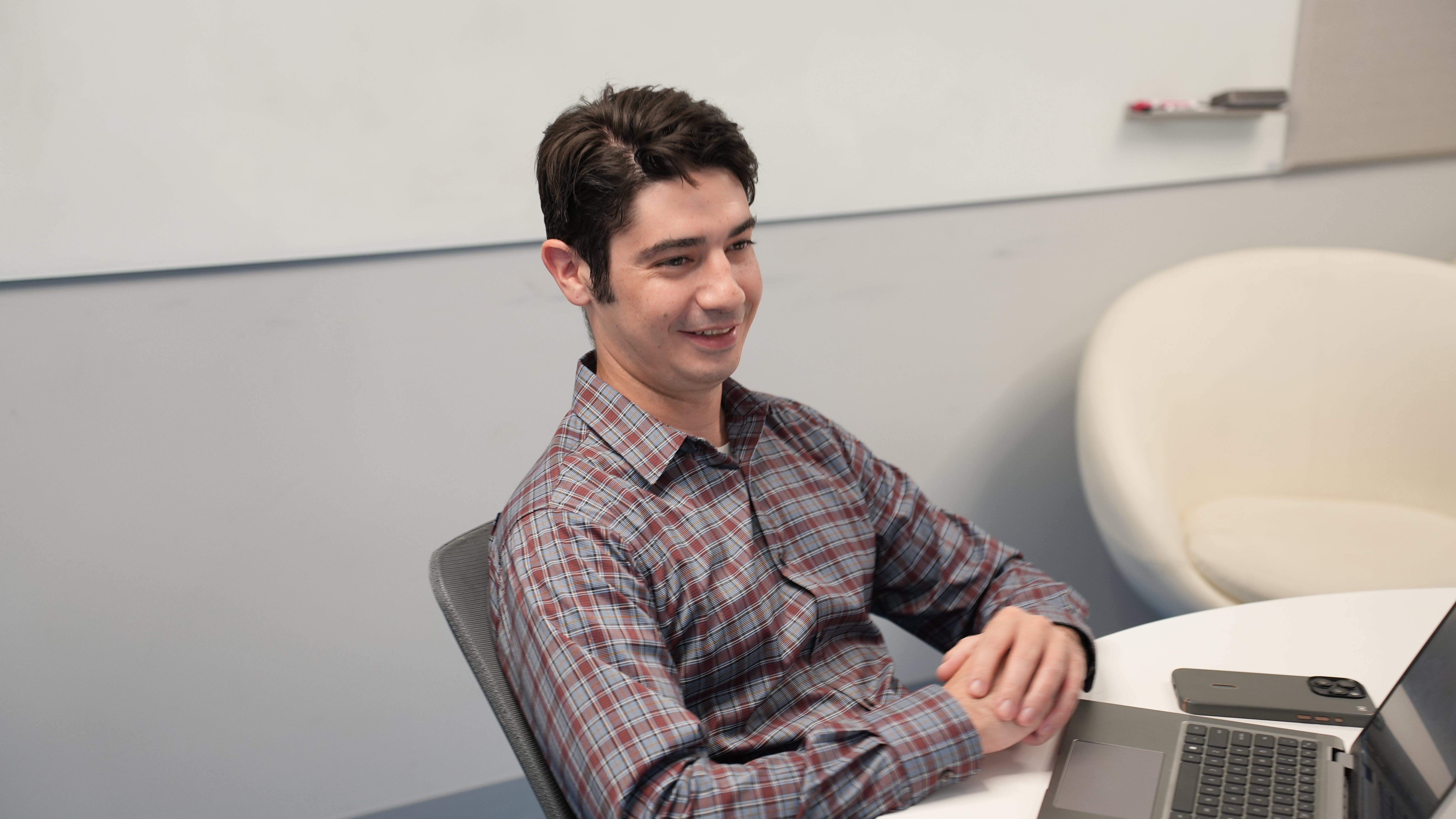 IT Security Professional sitting at table discussing it security 
